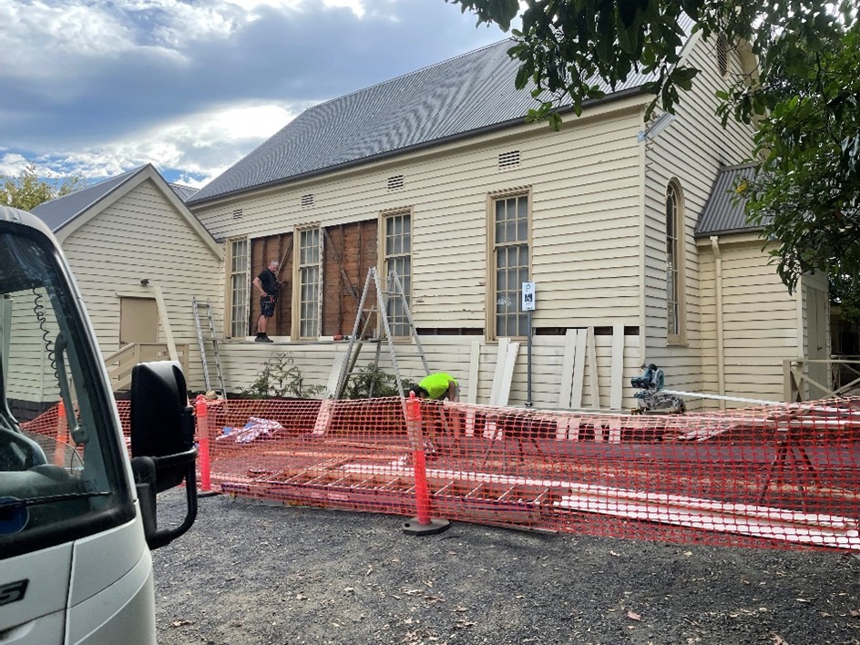 Building works on a cream colours weatherboard property